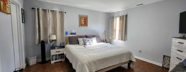 bedroom featuring dark wood-type flooring