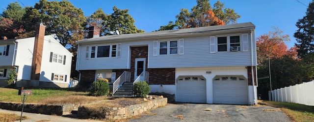 split foyer home featuring a garage