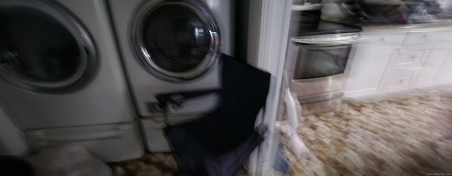 washroom featuring washer and clothes dryer