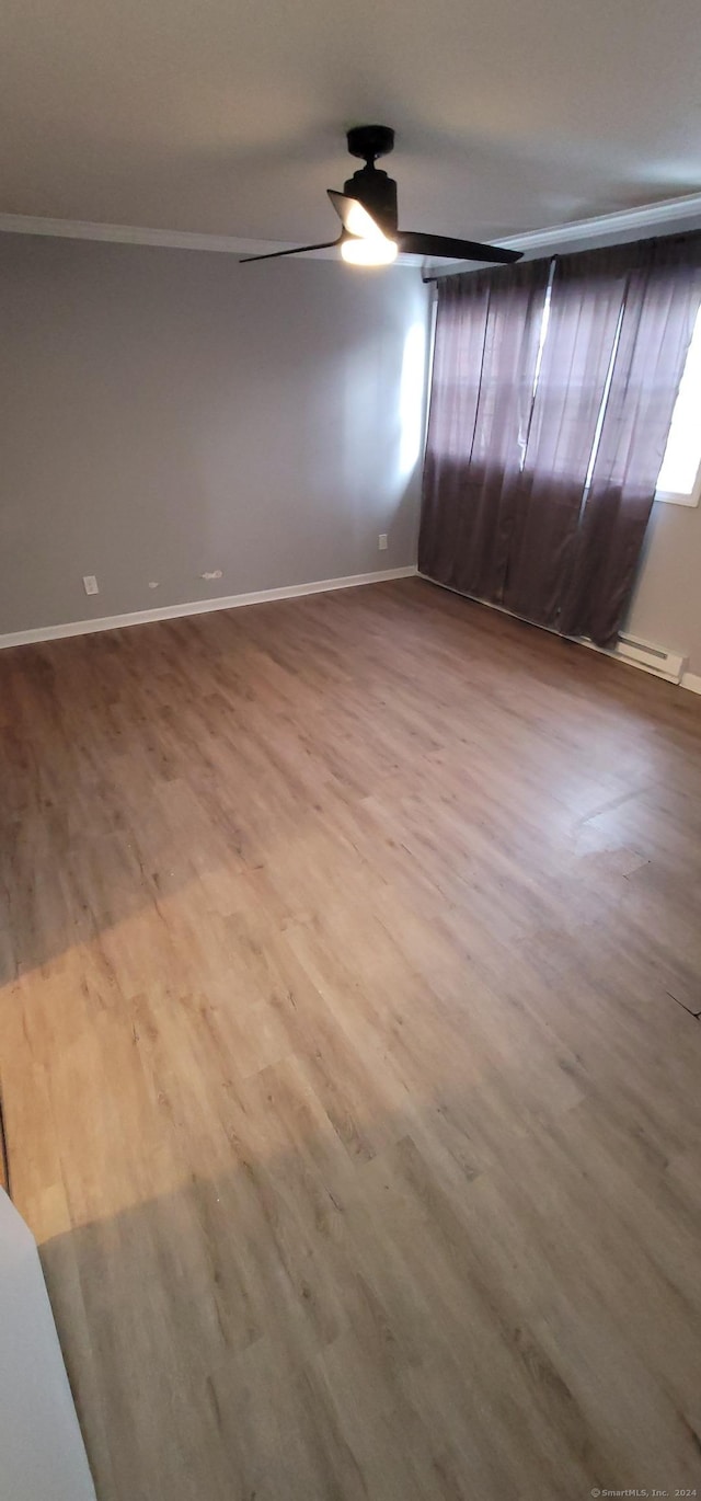 spare room featuring wood-type flooring