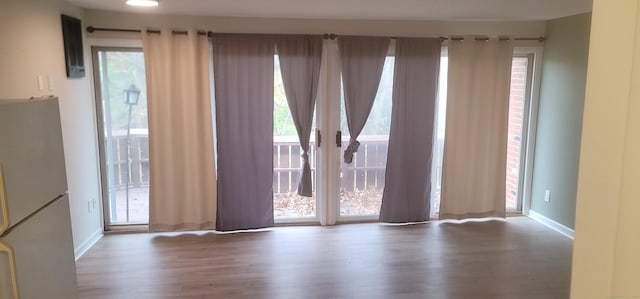 spare room featuring hardwood / wood-style flooring