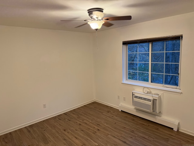 unfurnished room featuring dark wood-type flooring, ceiling fan, a wall mounted AC, and a baseboard heating unit