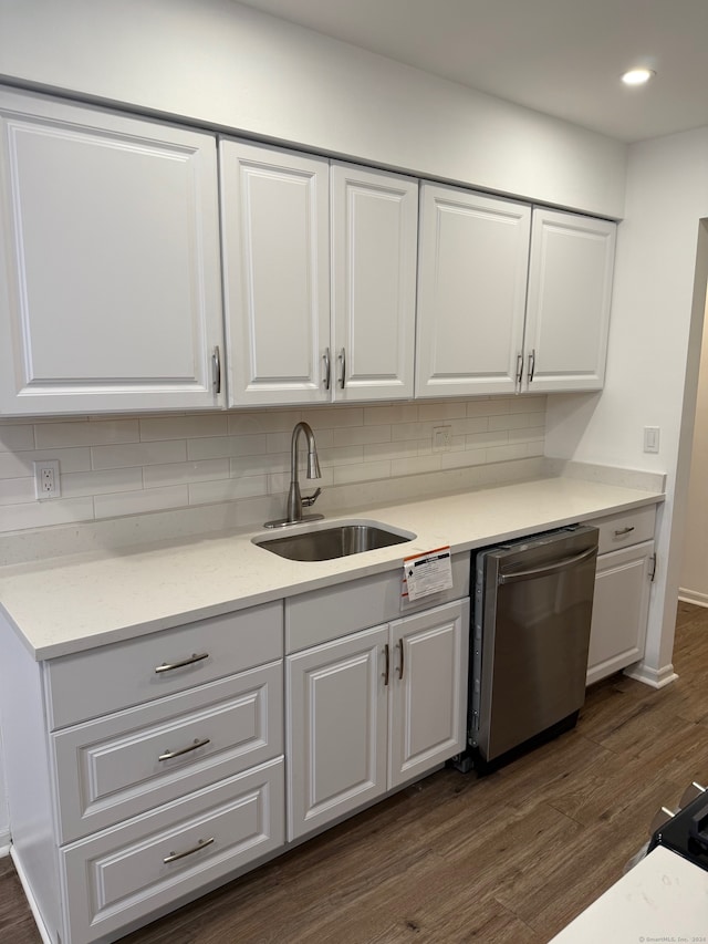 kitchen featuring stainless steel dishwasher, white cabinets, and dark hardwood / wood-style flooring