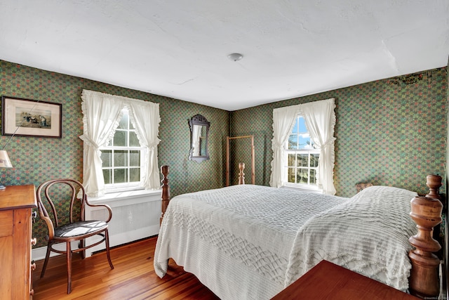 bedroom with wood-type flooring