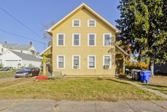 view of front of property with a front lawn and cooling unit