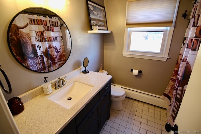 bathroom with tile patterned floors, vanity, toilet, and baseboard heating