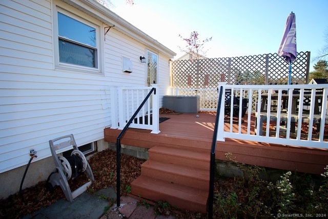 deck featuring central air condition unit