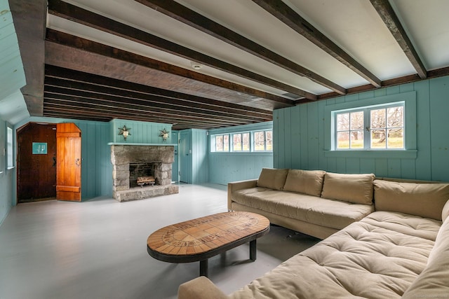 living area featuring a fireplace and beam ceiling