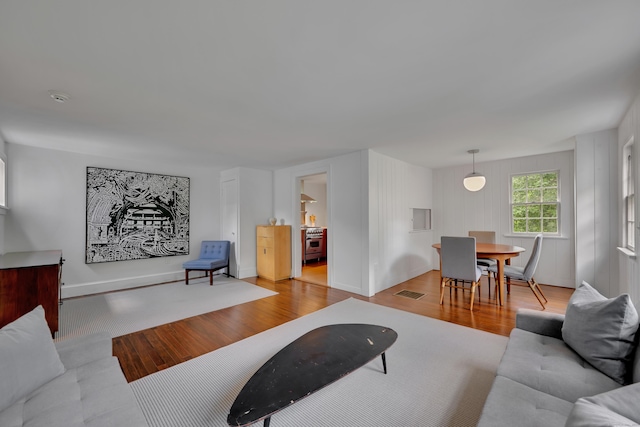 living area featuring wood finished floors and baseboards