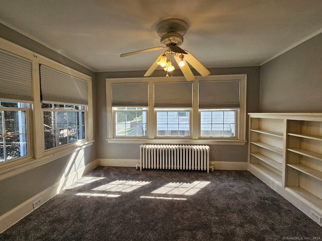 interior space with radiator and ceiling fan