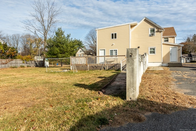 back of property featuring a yard