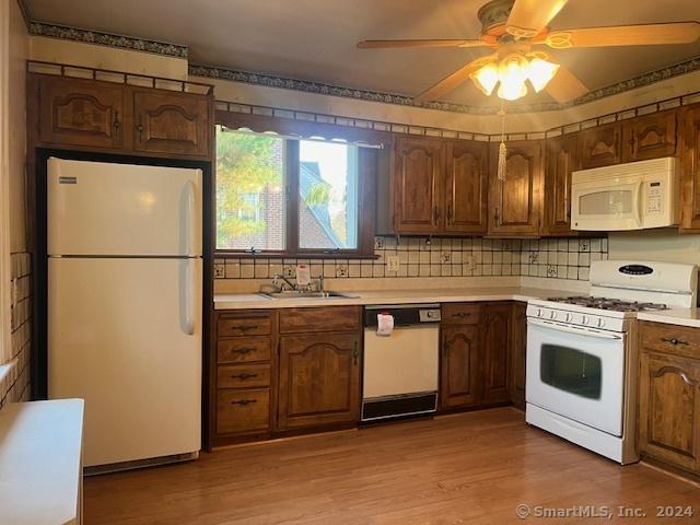 39 Rockefeller Ave, West Haven, CT 06516 - kitchen featuring white appliances, a sink, light countertops, and a ceiling fan