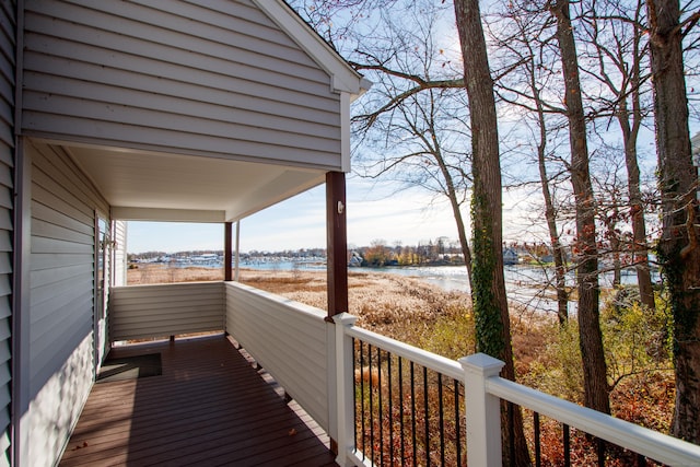 wooden terrace with a water view