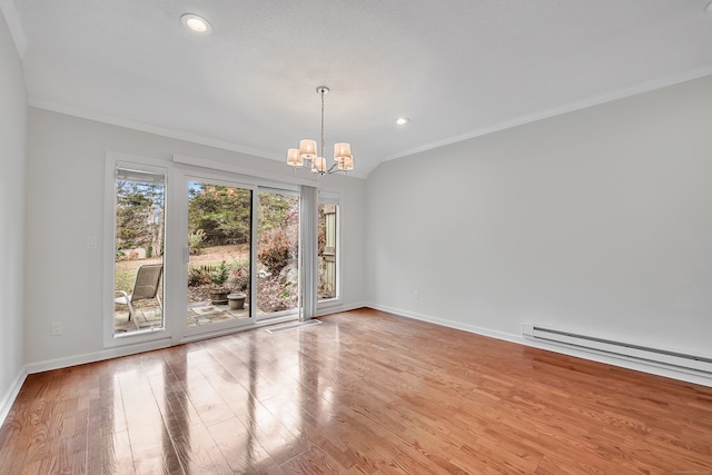 unfurnished room featuring light hardwood / wood-style floors, a chandelier, a baseboard heating unit, and crown molding