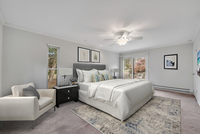 carpeted bedroom featuring a baseboard radiator, ceiling fan, and crown molding