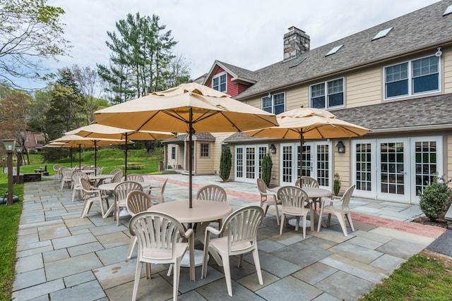 exterior space featuring french doors and an outdoor structure