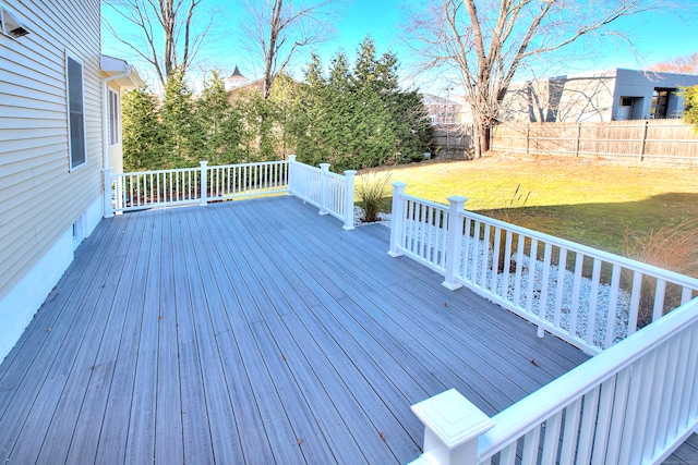 wooden terrace with a lawn