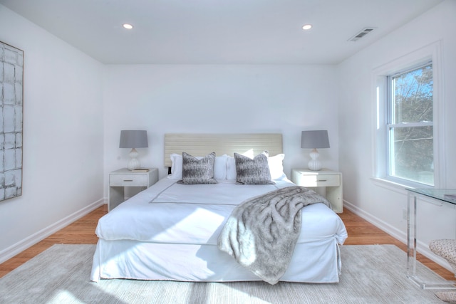 bedroom with light hardwood / wood-style floors