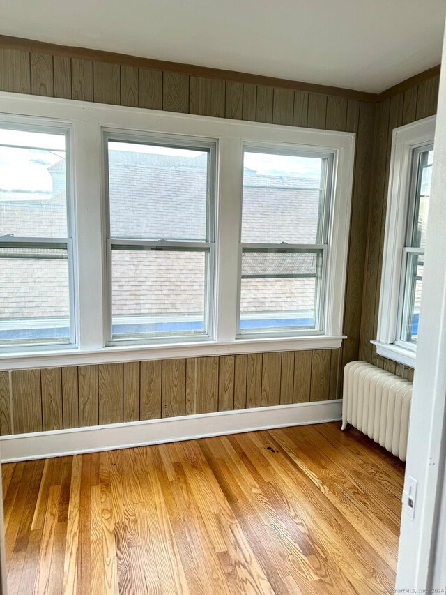 unfurnished sunroom with radiator