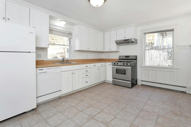 kitchen featuring white appliances, white cabinetry, sink, and plenty of natural light