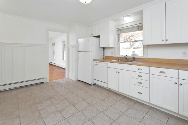 kitchen with white appliances, white cabinetry, sink, and crown molding