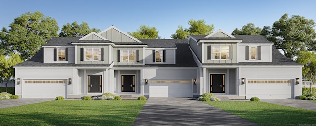 view of front of property featuring a garage and a front yard