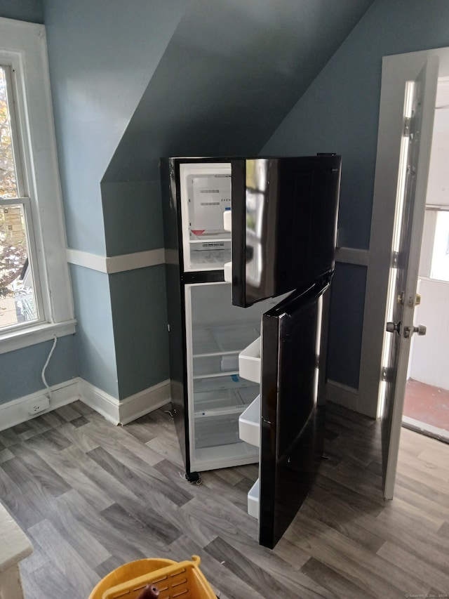 interior space featuring refrigerator and hardwood / wood-style floors