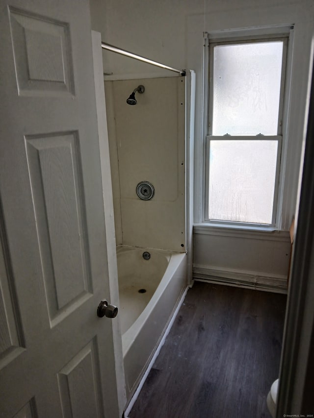 bathroom with shower / tub combination and wood-type flooring