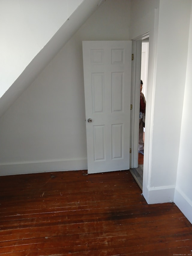 bonus room featuring dark wood-type flooring