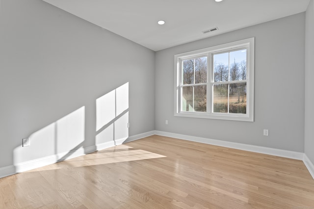 empty room with light hardwood / wood-style floors