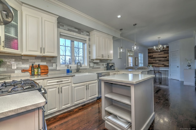 kitchen featuring white cabinets, dark hardwood / wood-style floors, and ornamental molding