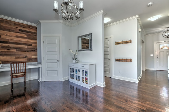 interior space featuring an inviting chandelier, dark wood-type flooring, and ornamental molding