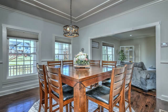 dining room featuring a healthy amount of sunlight and dark hardwood / wood-style floors