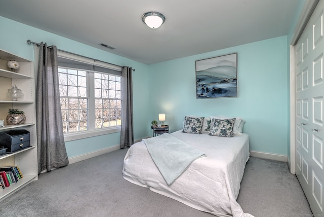 carpeted bedroom featuring a closet