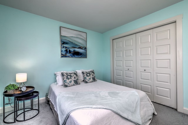 carpeted bedroom featuring a closet