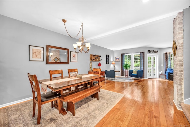 dining room featuring a chandelier and light hardwood / wood-style flooring