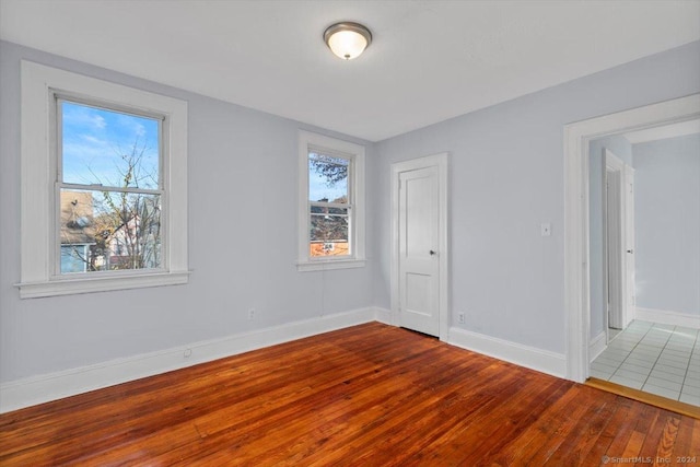 spare room with hardwood / wood-style flooring