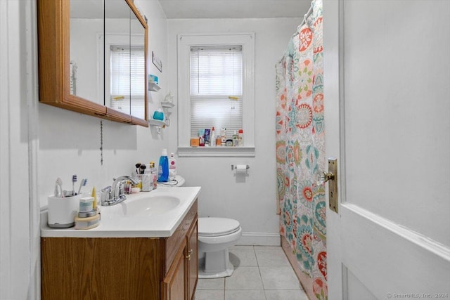 bathroom featuring toilet, a shower with curtain, vanity, and tile patterned floors