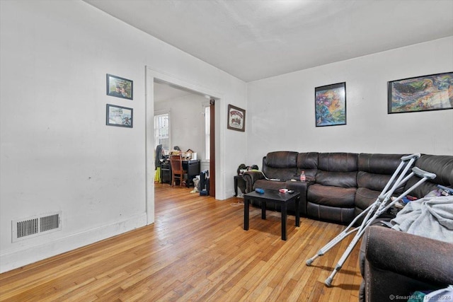 living room with light hardwood / wood-style flooring