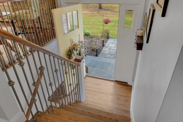 stairway featuring hardwood / wood-style floors