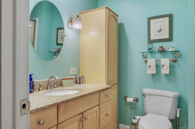 bathroom with vanity and toilet