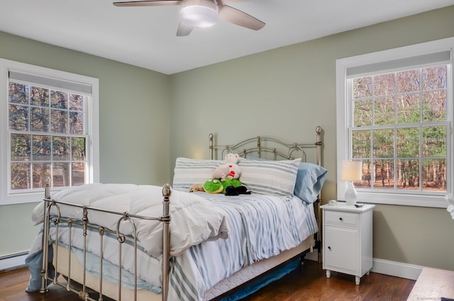 bedroom with ceiling fan and dark hardwood / wood-style flooring