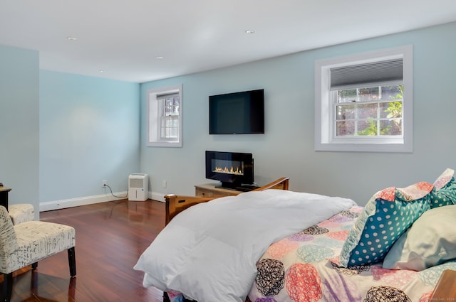 bedroom featuring dark hardwood / wood-style flooring