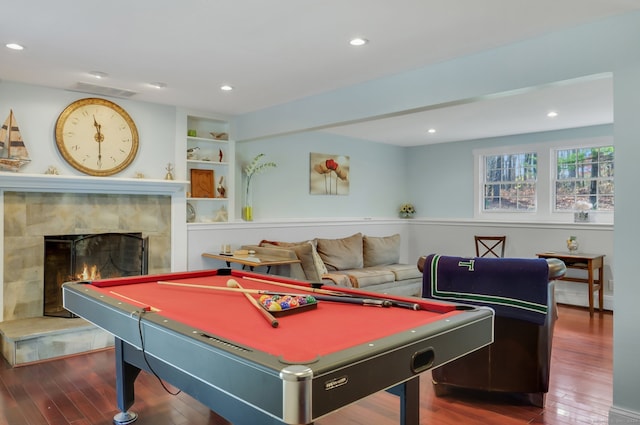 game room featuring a tile fireplace, dark wood-type flooring, and pool table