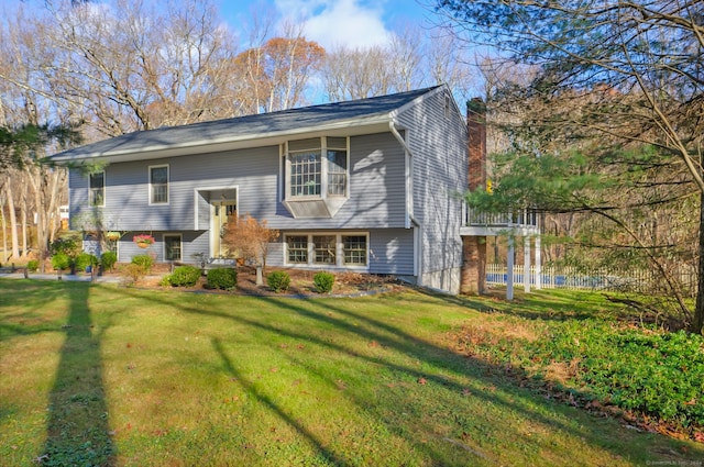 split foyer home with a front lawn