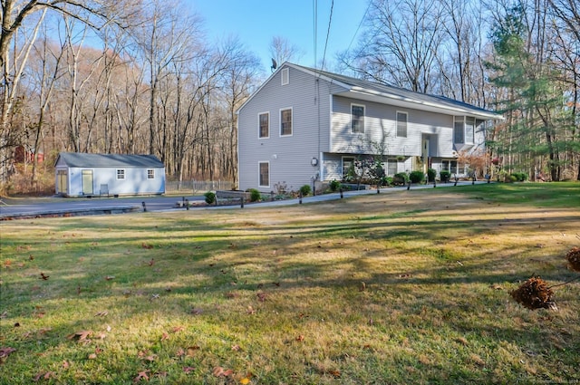 exterior space featuring a yard and an outdoor structure