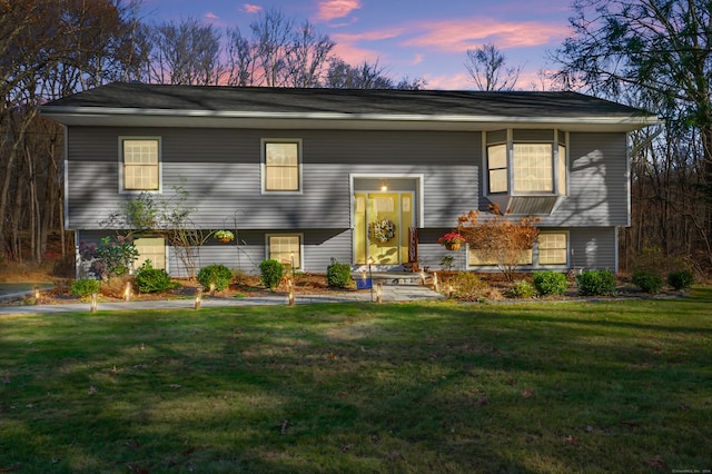 split foyer home with a lawn