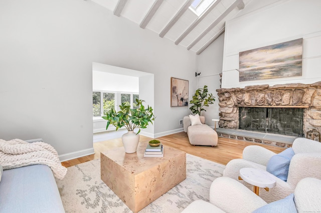 7 Topping Ln, Norwalk, CT 06854 - living room featuring wood finished floors, beam ceiling, baseboards, high vaulted ceiling, and a fireplace