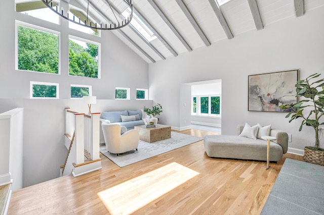7 Topping Ln, Norwalk, CT 06854 - living room with high vaulted ceiling, wood finished floors, a skylight, and beam ceiling