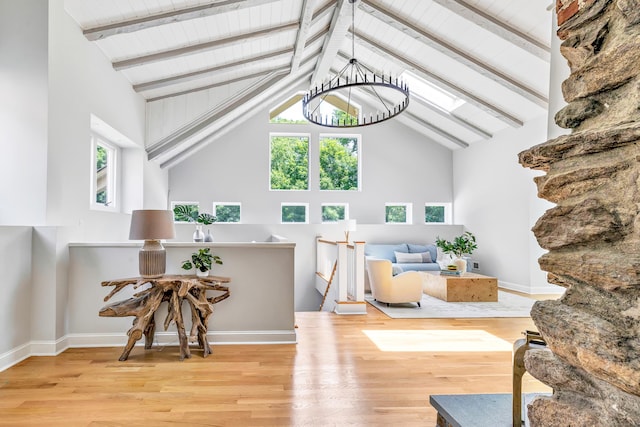 7 Topping Ln, Norwalk, CT 06854 - living room featuring high vaulted ceiling, a chandelier, wood finished floors, wood ceiling with exposed beams, and baseboards